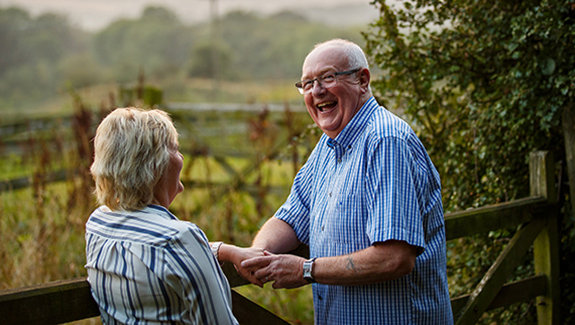 man-and-woman-outdoors-talking-side-by-side-and-understanding-a-urostomy